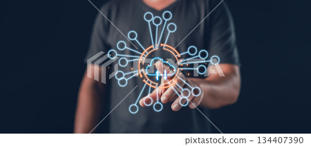 person interacts with a glowing cloud network interface symbolizing digital connectivity, cloud computing, data transfer, online synchronization, and integrated technological communication systems. person interacts with a glowing cloud network interface symbolizing digital connectivity, cloud computing, data transfer, online synchronization, and integrated technological communication systems. 134407390