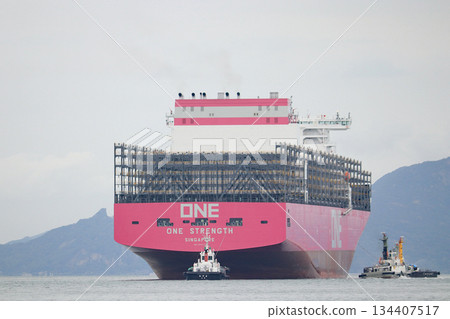 A huge container ship arrives at port 134407517