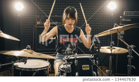 woman playing the drum 134407630