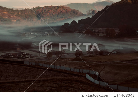Hiwa Mikawachi rice terraces in late autumn. Morning mist and sunrise. Connecting rice terrace heritage. Hiwa Mikawachi rice terraces in late autumn. Morning mist and sunrise. Connecting rice terrace heritage. 134408045