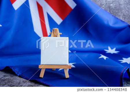 Mock-up for custom copy designs. Clean empty message board next to Australian flag. Place your logo or text on the white paper board next to the Australian flag. Modern mock-up template with national 134408348