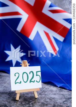 Australian flag and text 2025 trendy template for upcoming year campaigns. Patriotic design marking 2025 beside national flag. Concept of future vision and planning ideal for annual report or goal Australian flag and text 2025 trendy template for upcoming year campaigns. Patriotic design marking 2025 beside national flag. Concept of future vision and planning ideal for annual report or goal 134408350