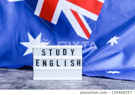 Message STUDY ENGLISH on background of Australian flag made from silk. Australia national flag with concept of tourism and traveling students opportunities scholarship programs Message STUDY ENGLISH on background of Australian flag made from silk. Australia national flag with concept of tourism and traveling students opportunities scholarship programs 134408357