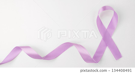 Lilac ribbon on white background. World Cancer Day on February 4. 134408491