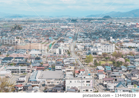 Tendo city with Sakura Cherry Blossom and snow mountain in Spring season, view from Tendo Park or Maizuru Park. Yamagata prefecture, Tohoku, Japan, 21 April 2025 Tendo city with Sakura Cherry Blossom and snow mountain in Spring season, view from Tendo Park or Maizuru Park. Yamagata prefecture, Tohoku, Japan, 21 April 2025 134408819