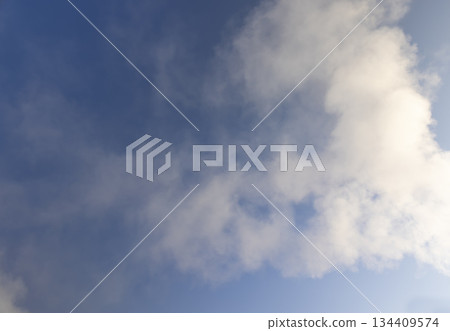 smoke coming from a pipe against a blue sky background, white steam coming from a pipe during heating of a large industrial premises in cold weather smoke coming from a pipe against a blue sky background, white steam coming from a pipe during heating of a large industrial premises in cold weather 134409574
