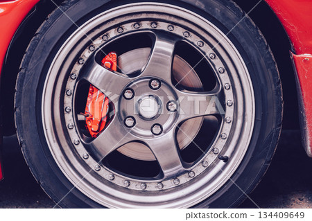 Sports car alloy wheels. Close-up of the car wheel. Street style and tuning. Sports car alloy wheels. Close-up of the car wheel. Street style and tuning. 134409649