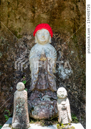 Jizo Bosatsu stone statues at Mitaki-Dera temple in Hiroshima, Japan 134409726