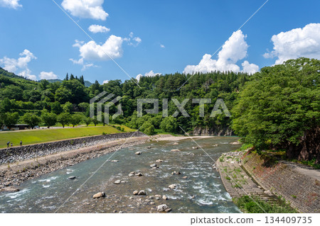 Sho River flowing through the village of Shirakawa-go, Japan Sho River flowing through the village of Shirakawa-go, Japan 134409735