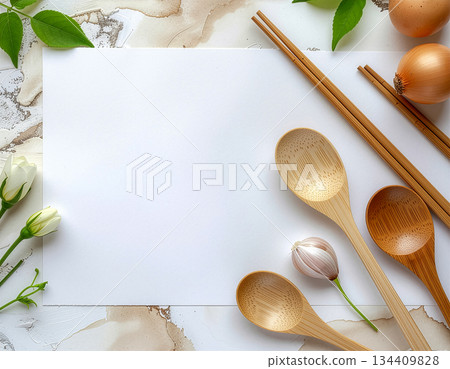 Flat lay composition of wooden spoons and chopsticks, blank paper with onions and flowers | Spoon, chopsticks, onion, blank paper, natural 134409828