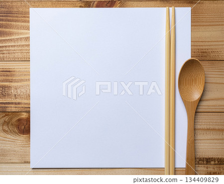 Flat lay composition of a blank paper and wooden table with wooden spoons and chopsticks | Spoon, chopsticks, wooden, blank paper, table 134409829