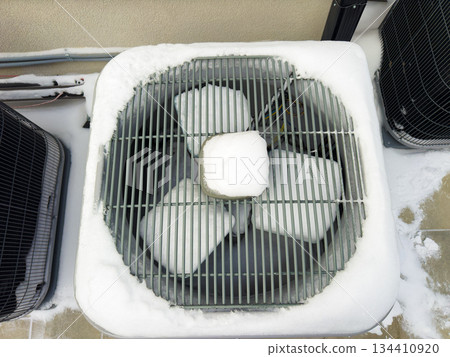 Outdoor HVAC units in winter snow 134410920