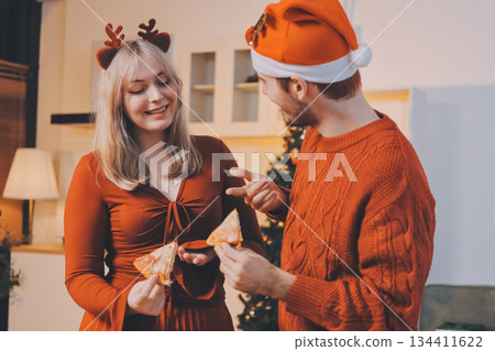 Festive Office Christmas Party with Delicious Food. A beautifully decorated office space with Christmas trees and festive lights, set up for a holiday party. Festive Office Christmas Party with Delicious Food. A beautifully decorated office space with Christmas trees and festive lights, set up for a holiday party. 134411622