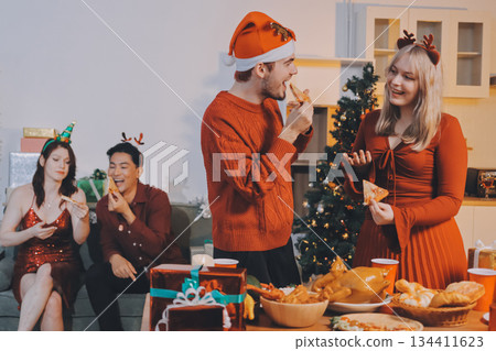 Festive Office Christmas Party with Delicious Food. A beautifully decorated office space with Christmas trees and festive lights, set up for a holiday party. Festive Office Christmas Party with Delicious Food. A beautifully decorated office space with Christmas trees and festive lights, set up for a holiday party. 134411623