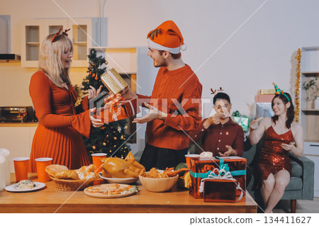 Festive Office Christmas Party with Delicious Food. A beautifully decorated office space with Christmas trees and festive lights, set up for a holiday party. Festive Office Christmas Party with Delicious Food. A beautifully decorated office space with Christmas trees and festive lights, set up for a holiday party. 134411627