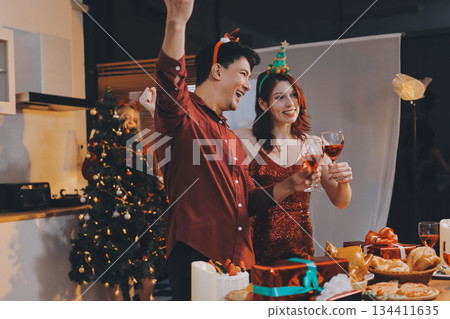 Festive Office Christmas Party with Delicious Food. A beautifully decorated office space with Christmas trees and festive lights, set up for a holiday party. Festive Office Christmas Party with Delicious Food. A beautifully decorated office space with Christmas trees and festive lights, set up for a holiday party. 134411635