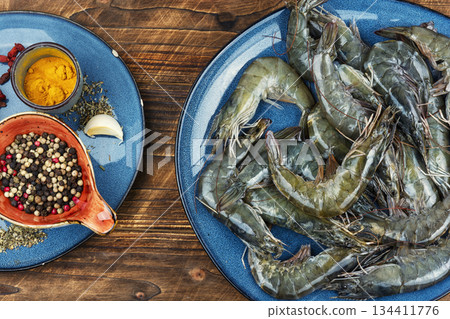 Seafood on a plate, pile of raw langoustines. Seafood on a plate, pile of raw langoustines. 134411776