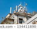 5G and 4G Mobile network directional antennas on the roof of residential building 134411890