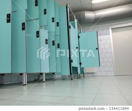 Lockers in empty locker room at sports club. Fitness center and swimming pool. Sports and health. 134411894