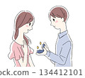 Illustration of a man and woman offering a ring 134412101