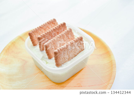 Stab the sable into the container of yogurt Stab the sable into the container of yogurt 134412344