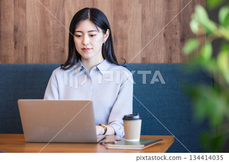 A woman working in a cafe 134414035