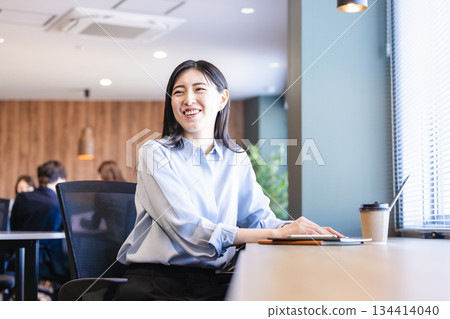 A woman working in a cafe 134414040