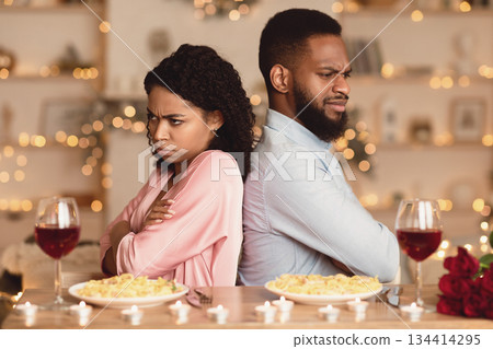 Offence, Argument, Family Conflict. Unhappy Sad African American Couple Sitting Back To Back On Date In Restaurant, Ignoring Each Other After Arguing. Offenced Man And Woman, Relationship Problem Offence, Argument, Family Conflict. Unhappy Sad African American Couple Sitting Back To Back On Date In Restaurant, Ignoring Each Other After Arguing. Offenced Man And Woman, Relationship Problem 134414295