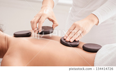 Relaxed Young Korean Lady Having Hot Stones Massage Session In Spa Salon, Lying On Table With Closed Eyes And Smiling, Beautiful Asian Female Enjoying Wellness Body Treatments, Side View, Closeup Relaxed Young Korean Lady Having Hot Stones Massage Session In Spa Salon, Lying On Table With Closed Eyes And Smiling, Beautiful Asian Female Enjoying Wellness Body Treatments, Side View, Closeup 134414726
