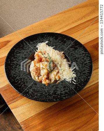 Velvety shrimp pasta presentation, Luxurious creamy prawn pasta served with Parmesan and thyme sprig Velvety shrimp pasta presentation, Luxurious creamy prawn pasta served with Parmesan and thyme sprig 134415772