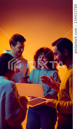 Startup team sharing ideas and digital content during meeting. 134415789