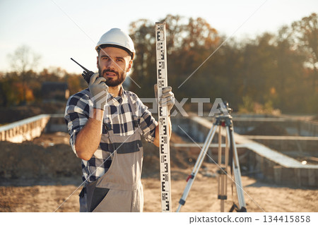 Worker is on the construction site at daytime 134415858