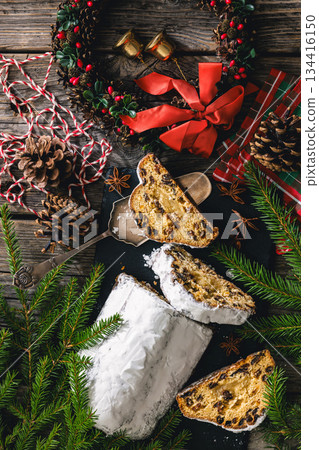 Stollen with filling of raisins, candied fruit 134416150