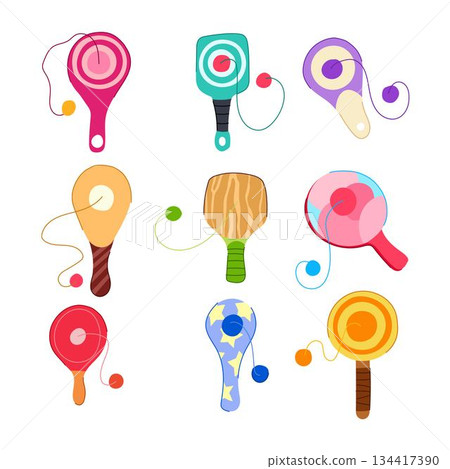Paddle ball toy set representing childhood play and fun 134417390