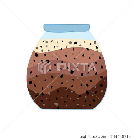 Layering healthy chia seed pudding in a glass jar 134418714