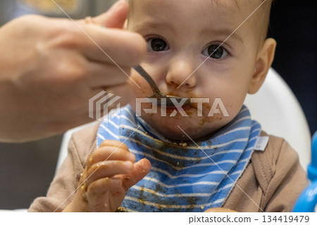 Baby Feeding Time with Messy Face Baby Feeding Time with Messy Face 134419479