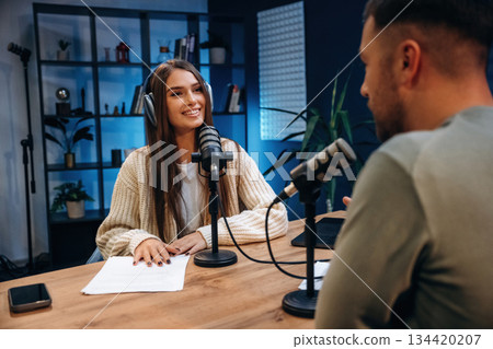 Having a conversation. Radio hosts recording podcast Having a conversation. Radio hosts recording podcast 134420207