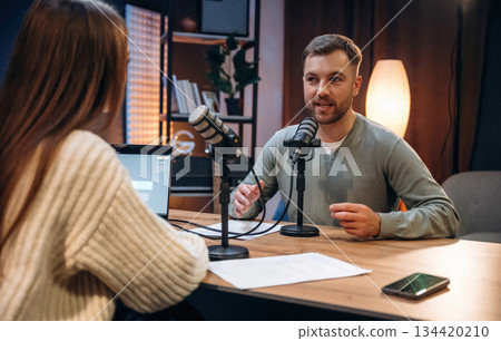 Having a conversation. Radio hosts recording podcast 134420210