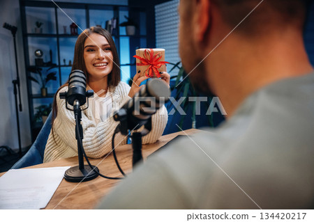 Man and woman are sitting. Radio hosts recording podcast 134420217