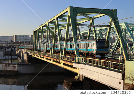 Keihin-Tohoku Line E233 series train crossing the Shingashi River Bridge Keihin-Tohoku Line E233 series train crossing the Shingashi River Bridge 134420395
