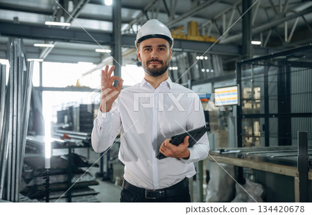 Man is working in the modern factory Man is working in the modern factory 134420678