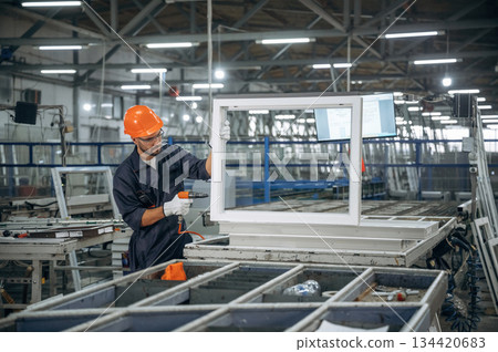 Busy at work. Man is in the modern factory 134420683