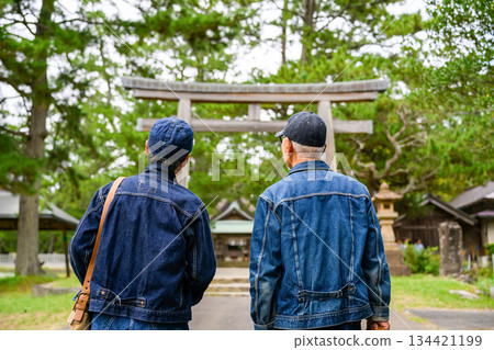 Two seniors in denim heading to a shrine 134421199