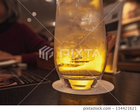 Sparkling carbonation and a golden highball 134421621