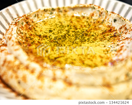 Rich hummus sparkling with olive oil Rich hummus sparkling with olive oil 134421624