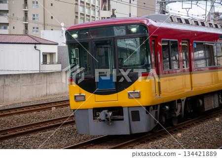 Keihan Railway express train passing through the quadruple track 134421889