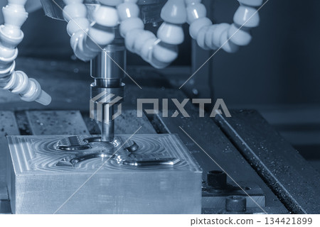 The CNC milling machine rough cutting the injection mold parts by indexable tools in the light blue scene. 134421899