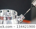The multi axis CMM machine measuring the aluminum housing parts. 134421900