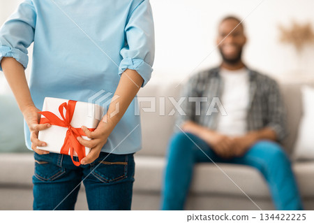 Father's Birthday. Son Preparing Surprise For Dad Holding Wrapped Gift Box Behind Back Congratulating Daddy On His B-Day At Home. Selective Focus On Present, Cropped. Family Holiday Concept. Rear View 134422225