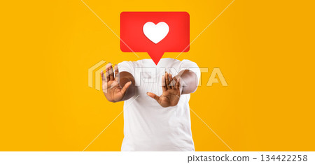 A person stands confidently with arms raised and palms facing forward as if to indicate stopping. Heart symbol is over their head A person stands confidently with arms raised and palms facing forward as if to indicate stopping. Heart symbol is over their head 134422258